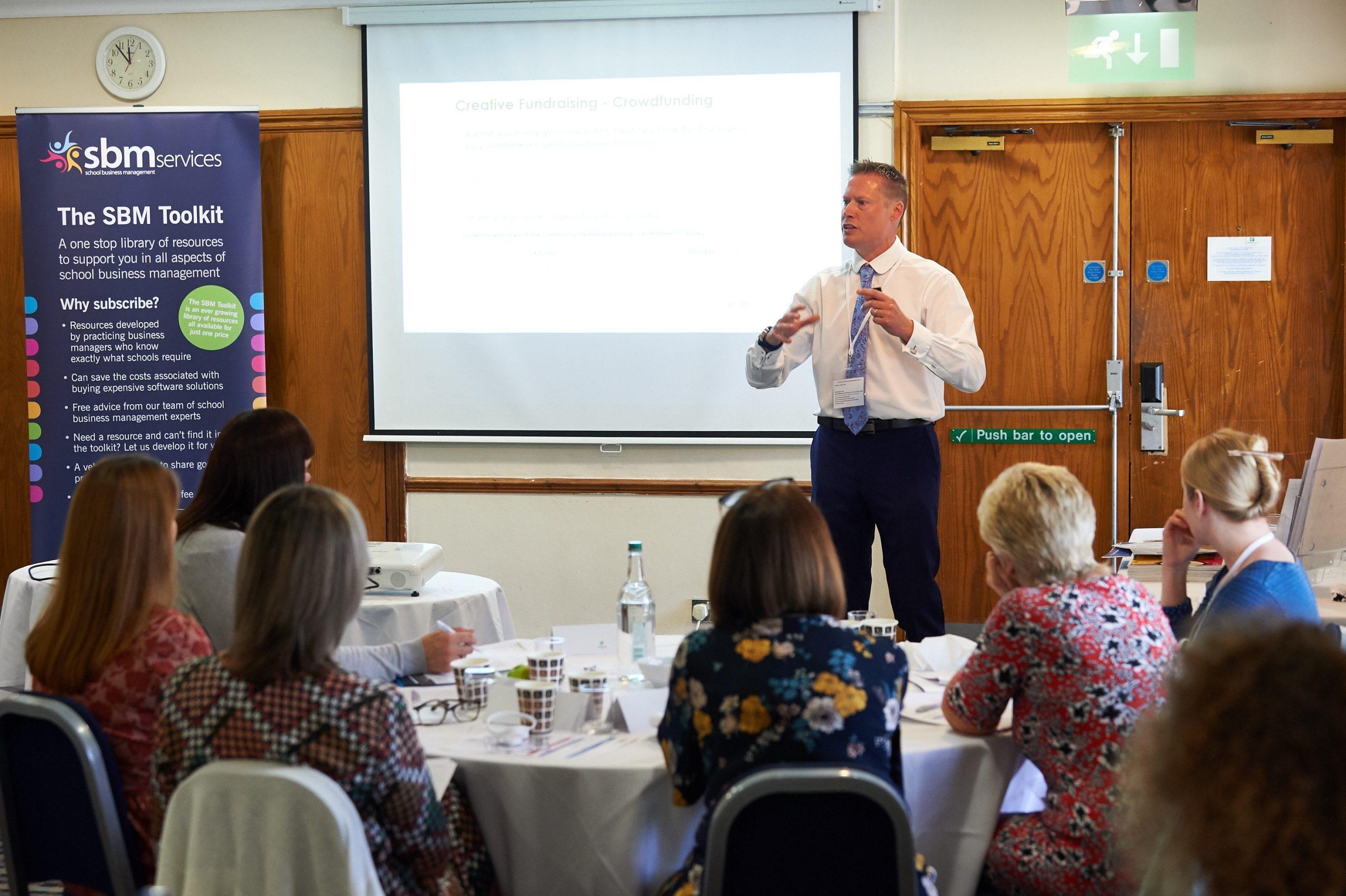 Justin Smith presenting a school fundraising training session to school business managers